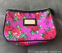 Front view showing floral pattern, logo plate, overall condition