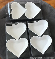 Three retail packs each holding two white heart bowls