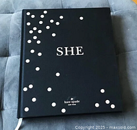 Front cover of hardcover book showing title and polka dot design