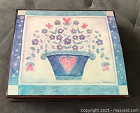 Top view showing folk art painting on lid