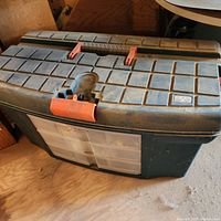 closed large dark green toolbox with orange latch and clear front drawer