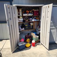 Full view of open shed showing variety of items