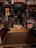 Delta 10" drill press on bench with table and wooden fence