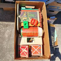 Top view of box showing barn pieces, Sesame Street roof panels and accessories