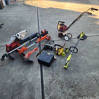 Group view of all power tools laid out on concrete