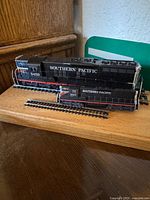 Two Southern Pacific diesel locomotives on short track sections