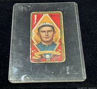 Full view of card front in clear plastic sleeve on black background