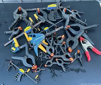 Top view of entire collection of 31 assorted clamps