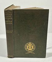 Photo of front cover showing title and author's name embossed in gold on green cloth binding.