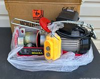 Photo of the Vevor PA800 electric hoist with motor, cable drum, control pendant wrapped in plastic