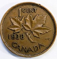 Reverse side of 1938 Canadian penny showing maple leaves and denomination details.