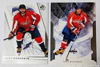 Two hockey cards showing Alex Ovechkin in Washington Capitals red uniform, posed with hockey stick, SP Authentic branding visible
