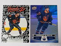 Two hockey cards side by side featuring Connor McDavid in Edmonton Oilers uniform.