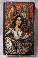 Front view of Labyrinth Tarot Card Set box featuring artwork of main characters and an owl illustration