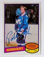 Front of vintage hockey card with Robbie Ftorek in blue Nordiques jersey, signed in blue ink by Robbie Ftorek.