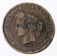 Front side of the 1897 French 10 Centimes coin, showing the profile of Marianne with text around the edges and the year at the bottom.