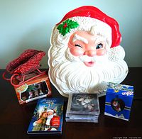 Overall view showing Santa head, sleigh, ornaments, DVDs, CD stack