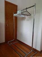 Rack with hangers displayed from side front angle