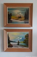 Both framed paintings stacked vertically on wall