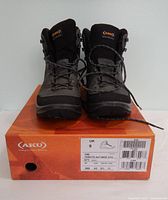 Front view of both AKU boots on box showing size label