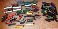 Full lot overview showing variety of train cars and locomotives