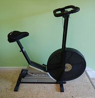 Left side profile of Johnson AccuFit bike showing frame, fan wheel and seat