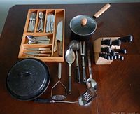 All items displayed: drawer organizer with flatware, cookware, utensils, knife block