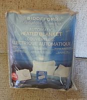Front of packaged Biddeford Delightful Moments automatic heated blanket
