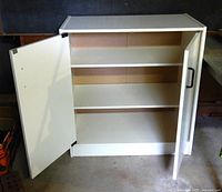 cabinet with right door open showing shelves