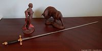 Sword, matador and bull displayed on table