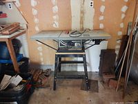 Delta Professional 8-1/4 in. table saw on stand in garage