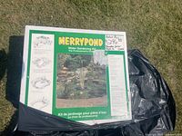 Front of boxed Merrypond Water Gardening Kit showing kit name, promotional pond image and bilingual text