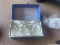 Three clear glass cat figurines in blue collector's box with satin lining and poem card.