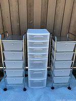 Front view of three drawer sets: two metal framed sets with plastic drawers on each side and Sterilite plastic drawer set in the middle.