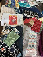 Various quilting fabrics and quilting patterns including the 'Poppy' flower design.