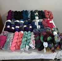All skeins and hanks laid out in four rows showing full lot