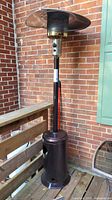 Full view of bronze propane patio heater on deck
