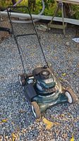 Full view of Craftsman mower showing deck, engine and handle