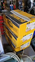 Stack of three DeWalt nail boxes showing brand and quantity