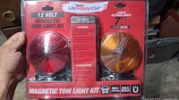 Front of sealed LifeSupply USA 12V Magnetic Tow Light Kit showing red and amber lights
