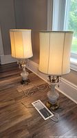 both lamps illuminated with shades on