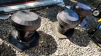 All three round roof vents on gravel