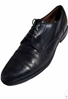 Single shoe angled view showing cap toe and vamp