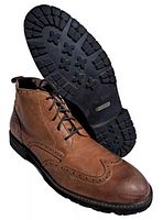 Boots side view with sole showing tread pattern and brand tag