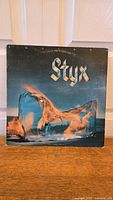 Front cover photo of the 'Equinox' vinyl album by Styx showing the main artwork and band name.