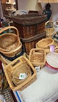 Group view showing majority of baskets including hampers, nested square baskets and Home Trends oval basket