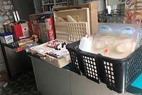 Wide view of basket with candy molds, storage tray with coloring tubes and squeeze bottle