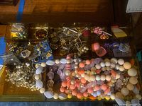 Drawer tray with multiple costume necklaces, earrings, brooches, bracelets and loose pieces