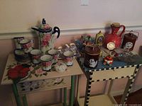 Overall lot view on two tables showing major ceramic and porcelain items