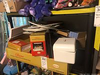 Lot overview showing Ellisimo branded boxes, hoops, and white attachment case